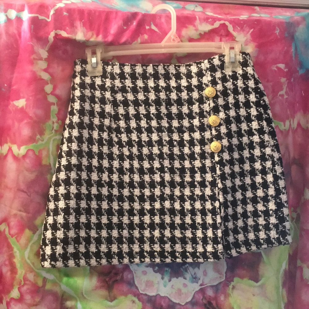 Black and white striped skirt with gold buttons
